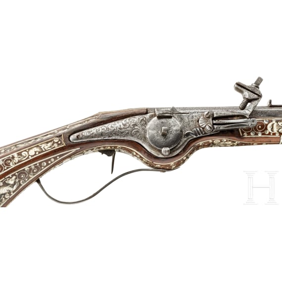 A profusely bone-inlaid wheel-lock arquebus, Teschen, circa 1650