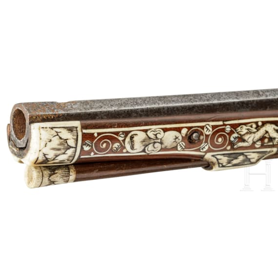 A profusely bone-inlaid wheel-lock arquebus, Teschen, circa 1650