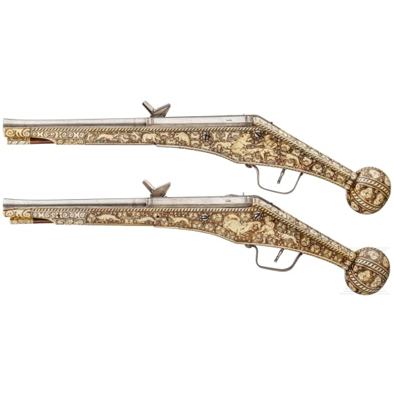 A pair of long wheellock pistols by Peter Danner, Nuremberg, dated 1587, with bone-inlaid stocks of later date