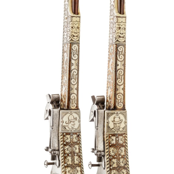 A pair of long wheellock pistols by Peter Danner, Nuremberg, dated 1587, with bone-inlaid stocks of later date