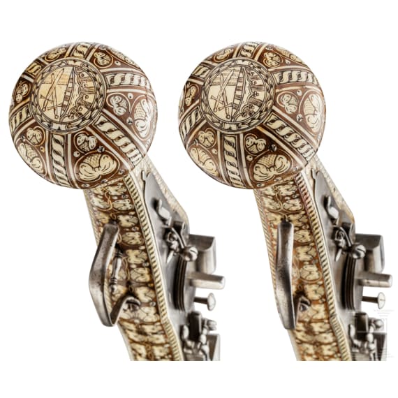 A pair of long wheellock pistols by Peter Danner, Nuremberg, dated 1587, with bone-inlaid stocks of later date