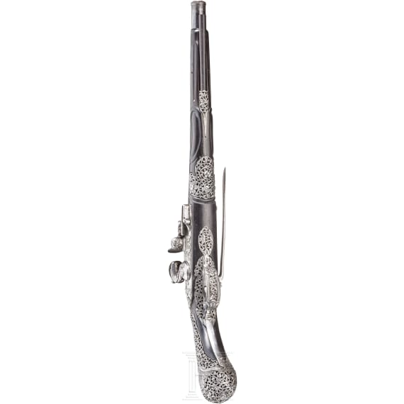 A chiselled flintlock pistol, Brescia, late 17th century
