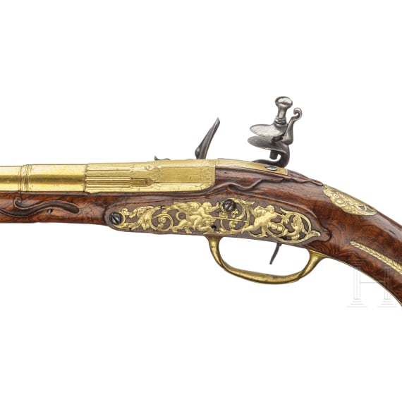 A splendid fire-gilt flintlock pistol by Jean Brion &agrave; Paris, circa 1710