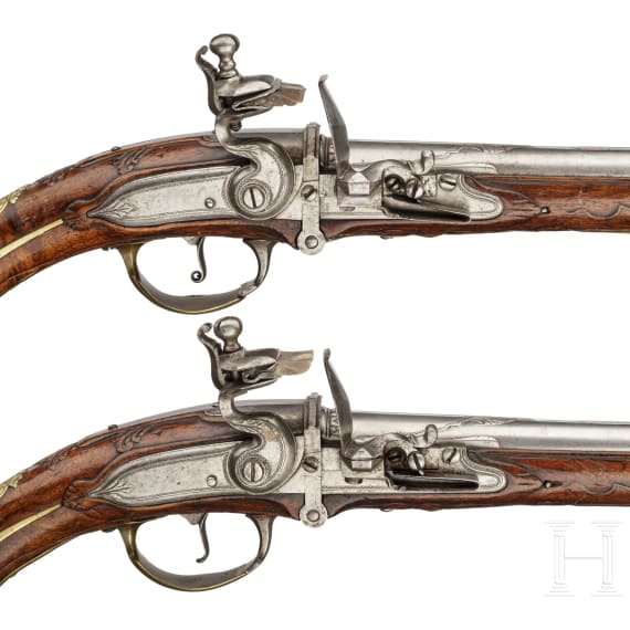 A pair of long Flemish breechloading flintlock pistols, circa 1720/30