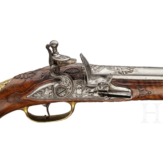 A deluxe German flintlock pistol with fine chiselling, circa 1730