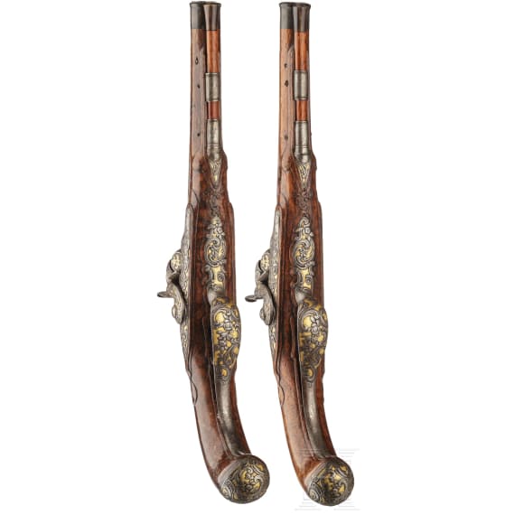 A fine pair of southern German percussion pistols with chiseled mounts, circa 1780