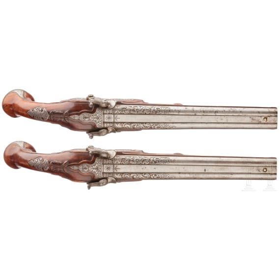 A pair of double-barreled percussion pistols with profuse chiselling, G. A. Moritz in Zella St. Blasii, circa 1820/30