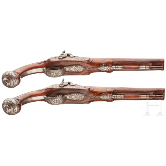 A pair of double-barreled percussion pistols with profuse chiselling, G. A. Moritz in Zella St. Blasii, circa 1820/30