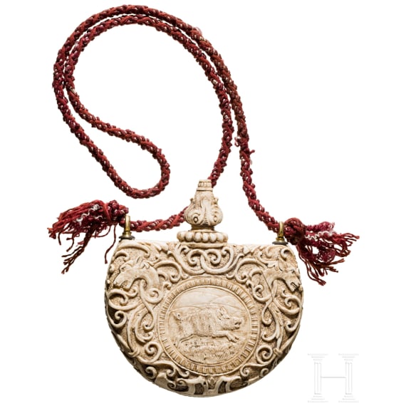 A German carved powder flask made of ivory, 19th century