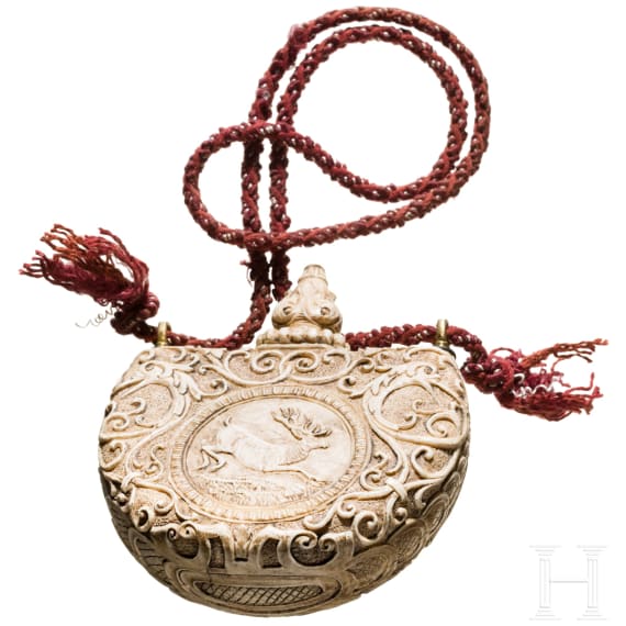 A German carved powder flask made of ivory, 19th century