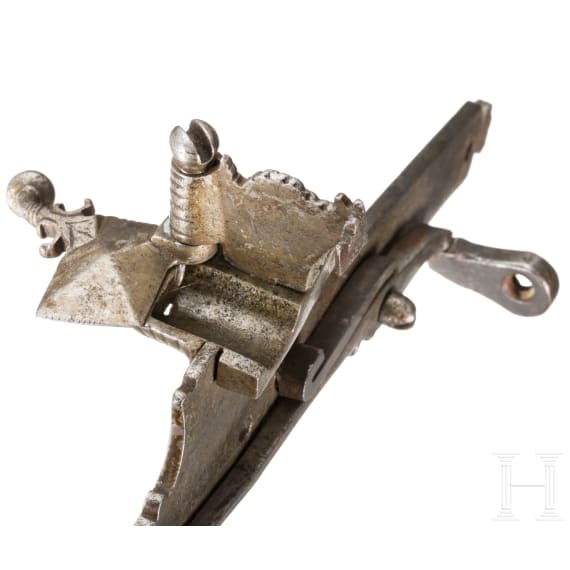 An Italian chiselled matchlock mechanism, 16th century