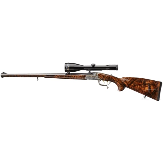 A cased deluxe break-action rifle by Karl Hauptmann, Ferlach, with Zeiss scope