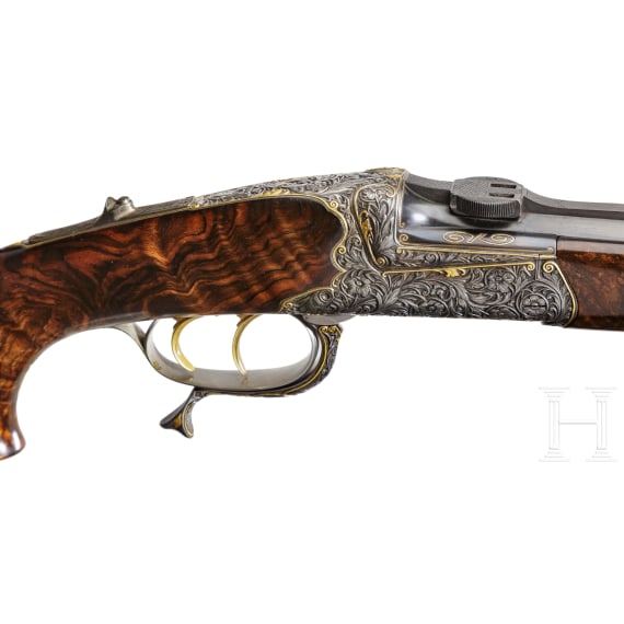 A cased deluxe break-action rifle by Karl Hauptmann, Ferlach, with Zeiss scope