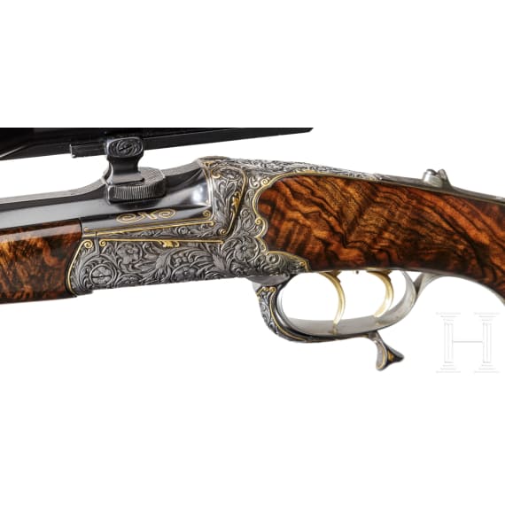 A cased deluxe break-action rifle by Karl Hauptmann, Ferlach, with Zeiss scope