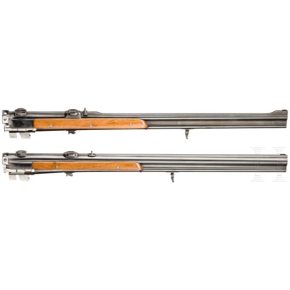 A cased double-barrelled over-and-under rifle by Hambrusch with three extra barrels