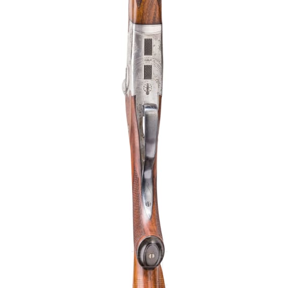 A Merkel over-and-under rifle with Zeiss scope, interchangeable O/U combination barrel with Zeiss scope, interchangeable O/U shotgun barrel