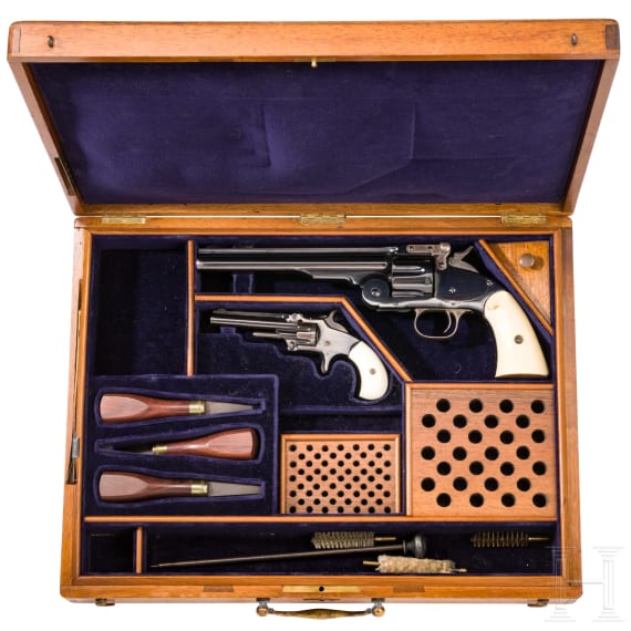 A cased Smith & Wesson 2nd Model Schofield Single Action Revolver and a No. 1 3rd issue revolver