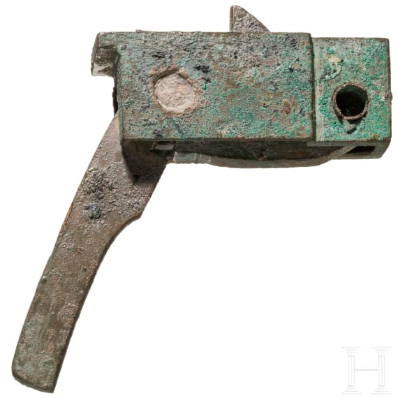 A Chinese crossbow lock and a collection of 29 arrow heads, Han dynasty, 206 B.C. – 220 A.D.
