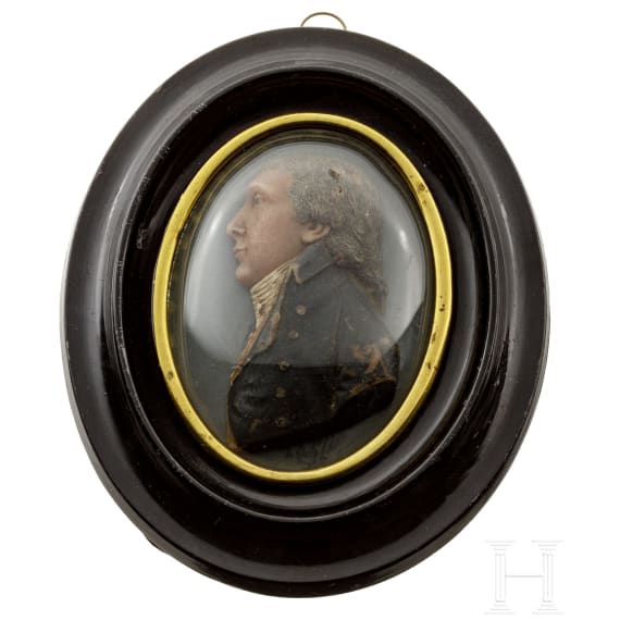 A French oval portrait of a gentleman in polychromely painted wax, circa 1800
