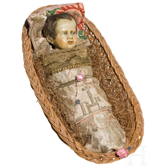A South German swaddled baby in a basket, 19th century