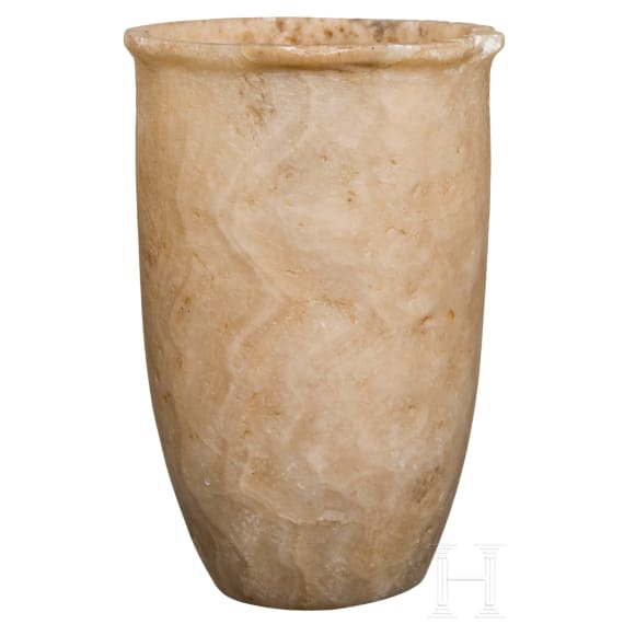 A tall, slender Egyptian alabaster cup, 2nd millennium B.C.