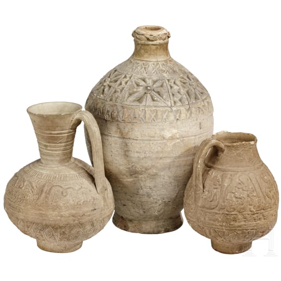Three Persian-Islamic clay vessels with relief decoration, 10th - 15th century