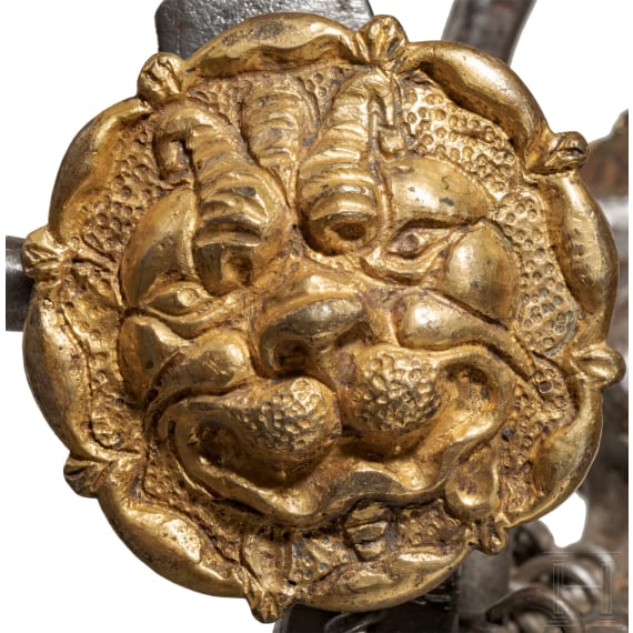 A French or Italian snaffle with gilt mascarons, 17th century
