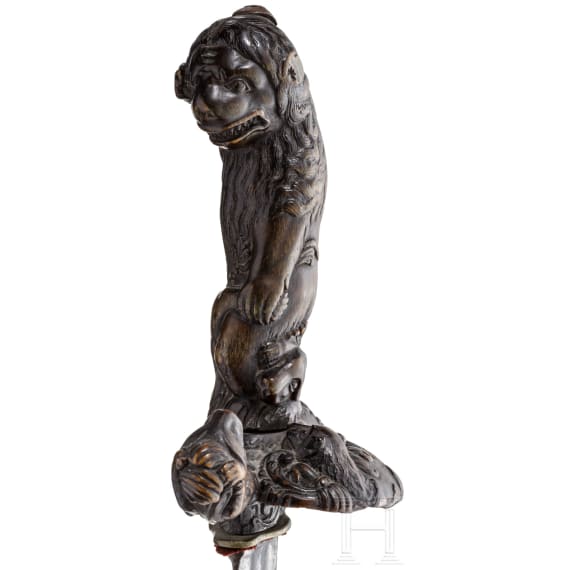 An important German deluxe hunting hanger with handle and guard made of finely carved rhinoceros horn, circa 1680