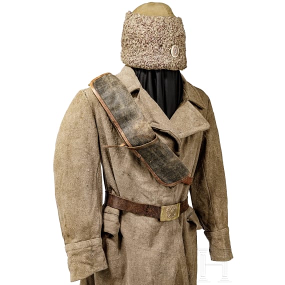 A coat, a field cap, a belt and an ammunition belt of a Russian soldier from World War I, circa 1915