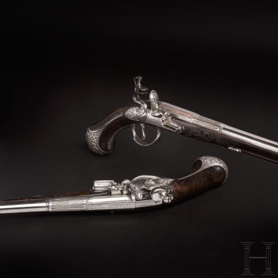 A pair of fine deluxe flintlock pistols with chiselled mounts, S. Charlet à Lyon, circa 1700