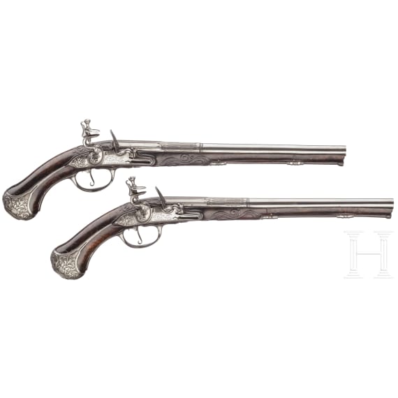 A pair of fine deluxe flintlock pistols with chiselled mounts, S. Charlet à Lyon, circa 1700