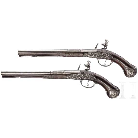 A pair of fine deluxe flintlock pistols with chiselled mounts, S. Charlet à Lyon, circa 1700
