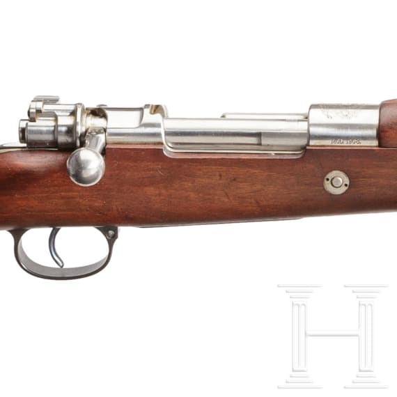A Mauser rifle Mod. 1908, by DWM, with matching bayonet
