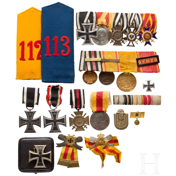 A small military medal estate with two medal bars, an Iron Cross 1st class in box and other badges