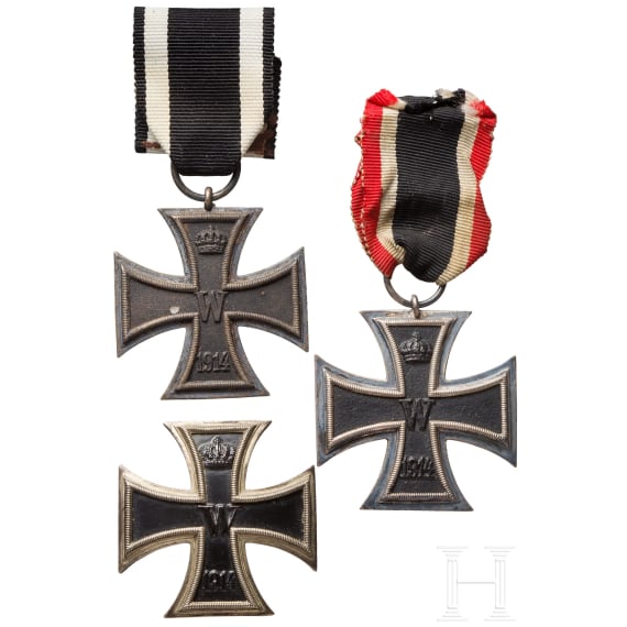 A small military medal estate with two medal bars, an Iron Cross 1st class in box and other badges