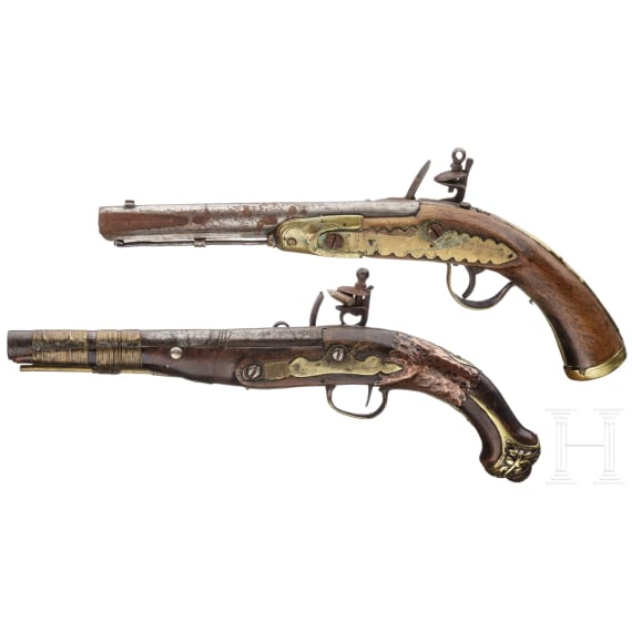Two Moroccan flintlock pistols and a powder flask, 19th./20th century