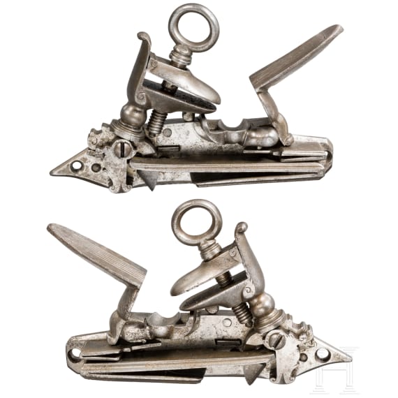 A pair of Spanish Miquelet-type flintlock mechanisms for a double-barrel gun, circa 1800