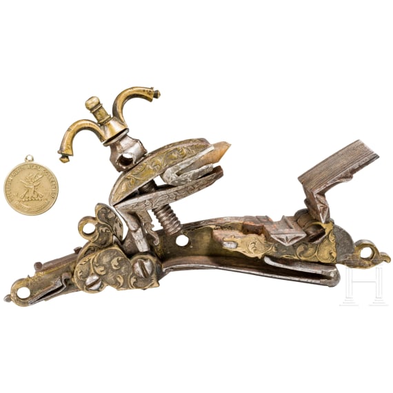 A brass-inlaid Miquelet flintlock, Algeria, early 19th century