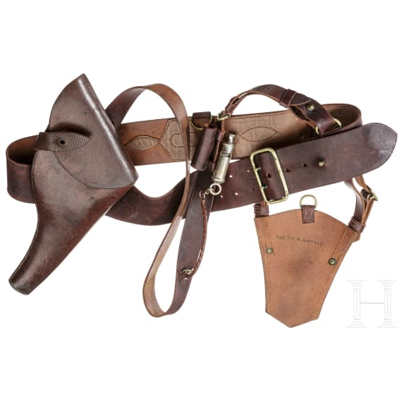 A holster, belt, shoulder strap, sabre bag and a whistle for a Webley revolver