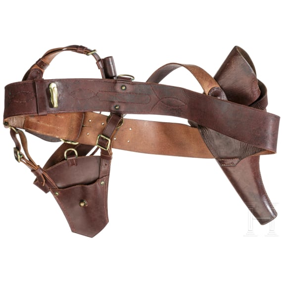 A holster, belt, shoulder strap, sabre bag and a whistle for a Webley revolver