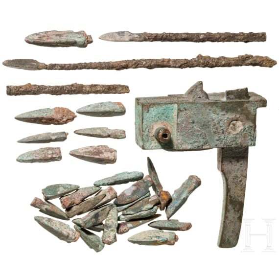 A Chinese crossbow lock and a lot of 29 arrow heads, Han dynasty, 206 B.C. – 220 A.D.