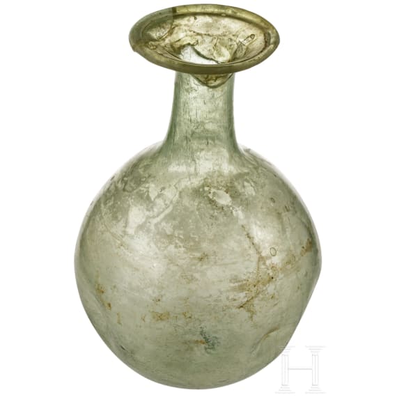 A bellied Roman glass bottle, 1st - 3rd century