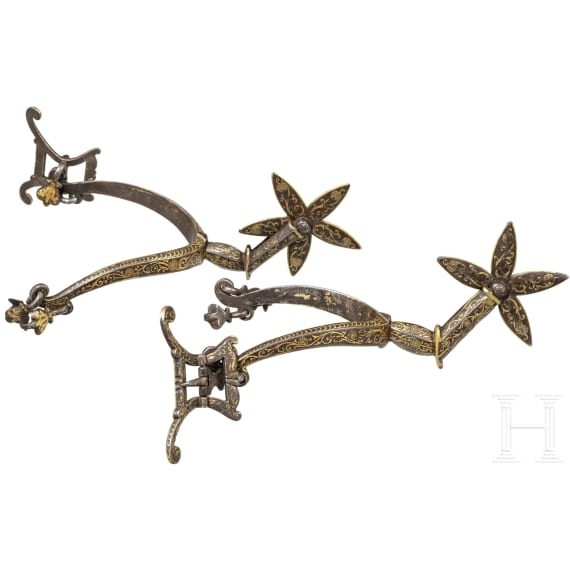 A pair of French or English gold-inlaid spurs, early 17th century