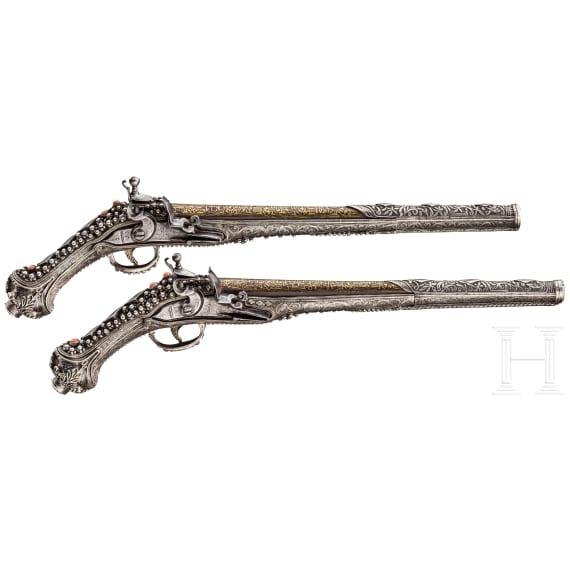 A deluxe pair of Balkan Turkish gold-inlaid and silver-mounted flintlock pistols, 19th century