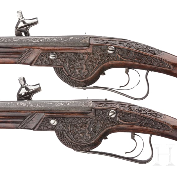 A pair of Viennese deluxe wheellock pistols, Master of the Animal-head Scroll, circa 1630/40