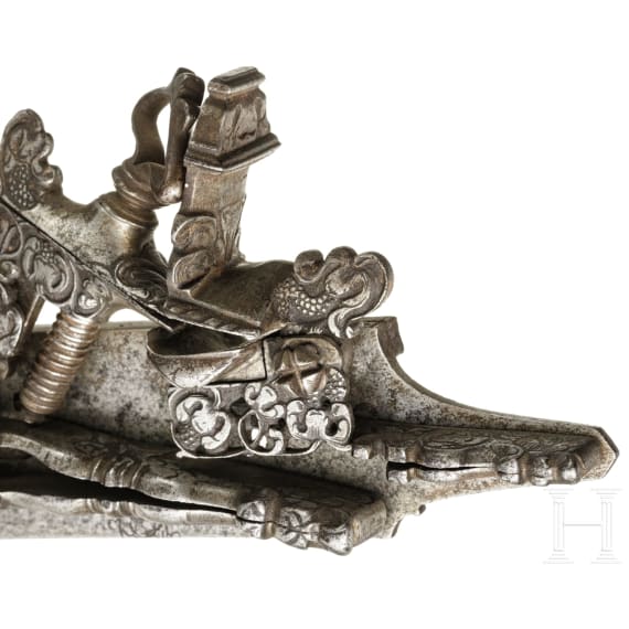 A chiselled Italian double miquelet lock, probably Brescia, circa 1700