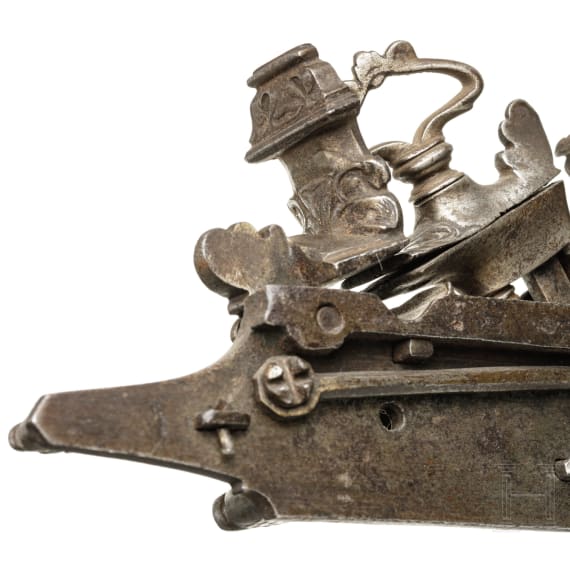 A chiselled Italian double miquelet lock, probably Brescia, circa 1700