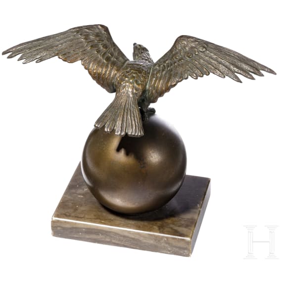 A small table eagle on a globe