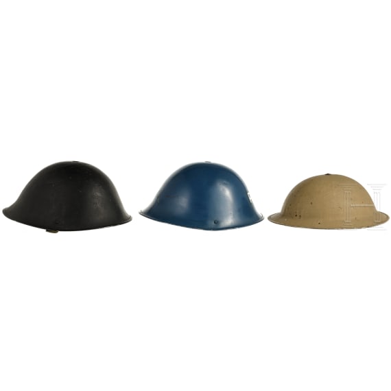 Three British steel helmets