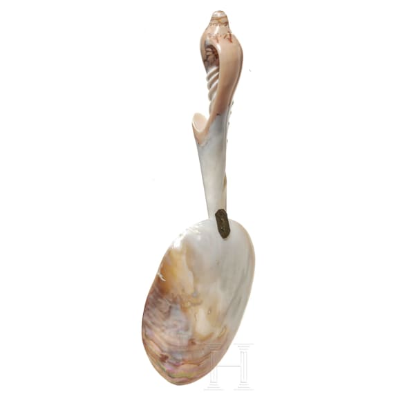 A spoon made from parts of a shell, circa 1900